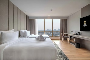 Chambre Deluxe avec lits jumeaux | Minibar, coffres-forts dans les chambres, Wi-Fi gratuit