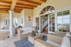 Family Villa, 4 Bedrooms, Mountainside (Villa Tre Pini) | Living area | 21-inch Smart TV with satellite channels, fireplace