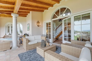 Family Villa, 4 Bedrooms, Mountainside (Villa Tre Pini) | Living area | 21-inch Smart TV with satellite channels, fireplace