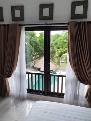 Deluxe Double Room, Pool View | Blackout drapes, soundproofing, iron/ironing board, free WiFi - Glam Canggu (Canggu)