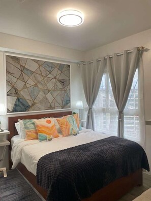 Family Condo, 1 Bedroom, Pool Access, City View | Individually decorated, individually furnished, desk, laptop workspace - Mesavirre Garden Residences Furnished Units (Bacolod)