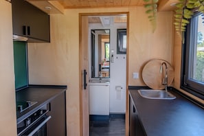 Fridge, oven, coffee/tea maker, cookware/dishes/utensils