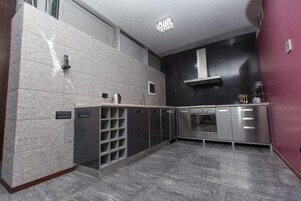 Luxury Apartment, Multiple Beds | Private kitchen | Mini-fridge, microwave, coffee/tea maker, electric kettle
