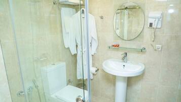 Hair dryer, slippers, towels, soap