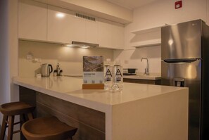 Fridge, microwave, stovetop, coffee/tea maker