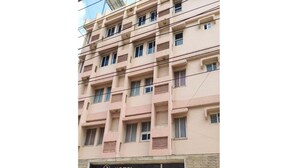 A multi-story hotel building with a sign reading "HOTEL Dwarka." - Hotel Dwarika Inn (Rajkot)