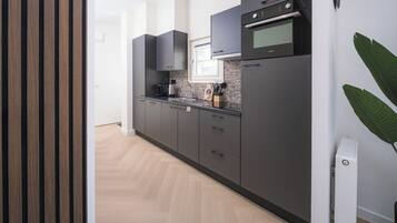 Microwave, dishwasher, dining tables