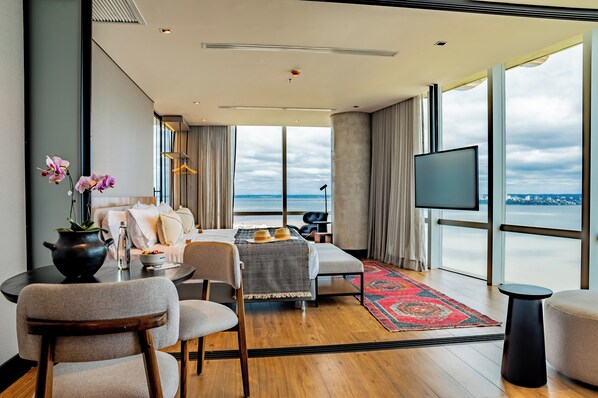 Panoramic Suite, River View | Premium bedding, minibar, individually decorated, individually furnished