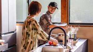 A kitchen with a modern design, featuring a stainless steel sink, a window, and a stove. - Villa SCALA (Sumoto)