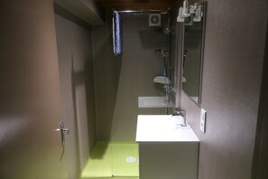 Shower, hair dryer, towels, toilet paper