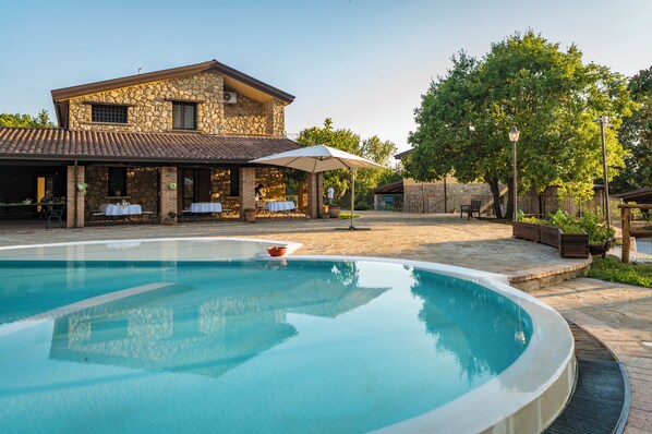 Outdoor pool, pool umbrellas, sun loungers