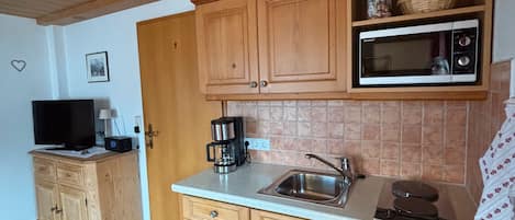 Fridge, microwave, stovetop, coffee/tea maker