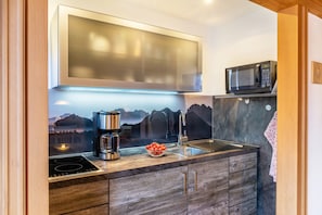 Fridge, microwave, stovetop, coffee/tea maker