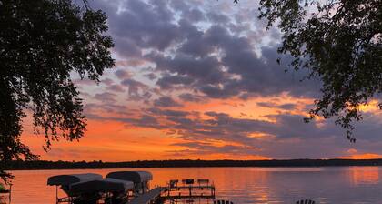 Sunset Cottage on Lake Wapogasset, Amery WI with Bunk Room, Hot Tub, AC, & more