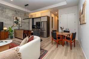 A modern apartment with a living room, dining area, kitchen, and a separate dining room. - *NEW Mid-Century Modern 2B/1B (Halifax)