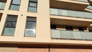 A multi-story building with balconies and windows. - VERARLANZA LERMA BURGOS (Lerma)