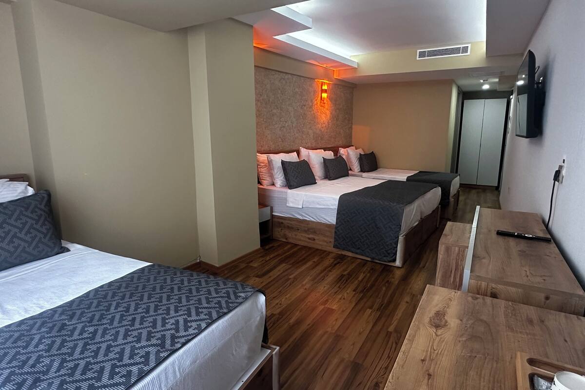 Family Quadruple Room, Balcony, Garden View | In-room safe, desk, soundproofing, iron/ironing board