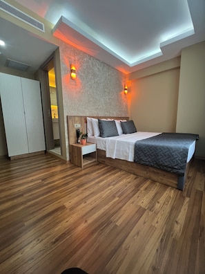 Deluxe Double Room, City View | In-room safe, desk, soundproofing, iron/ironing board