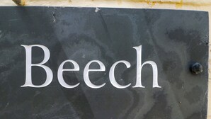 A black sign with the word "Beech" in white letters. - Beech (Newbury)