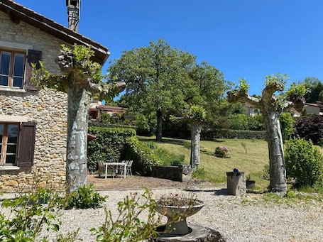 Property grounds. Stone house on the heights of Ambérieu. View of the Bugey mountains