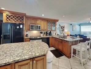 Fridge, microwave, oven, stovetop - Dolphin Lair | Oceanfront + Pool (Galveston)
