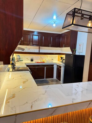 Private kitchen - House B 3BR w/arcade fooseball along Commonwealth (Quezon City)