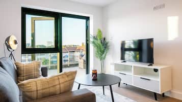 Apartment | Living area | 40-inch Smart TV with digital channels, streaming services