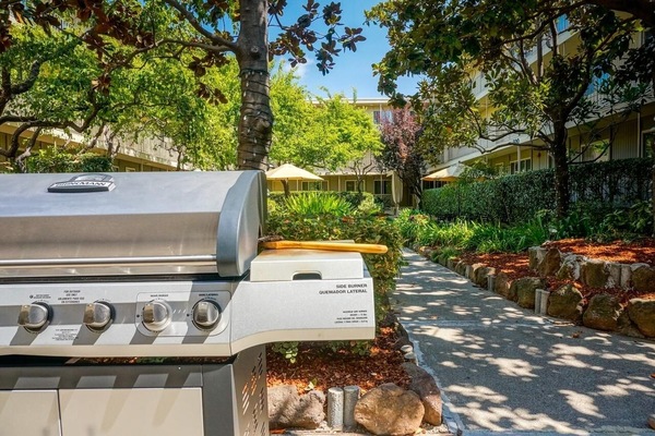 Gather for sunny cookouts on the shared garden grill.