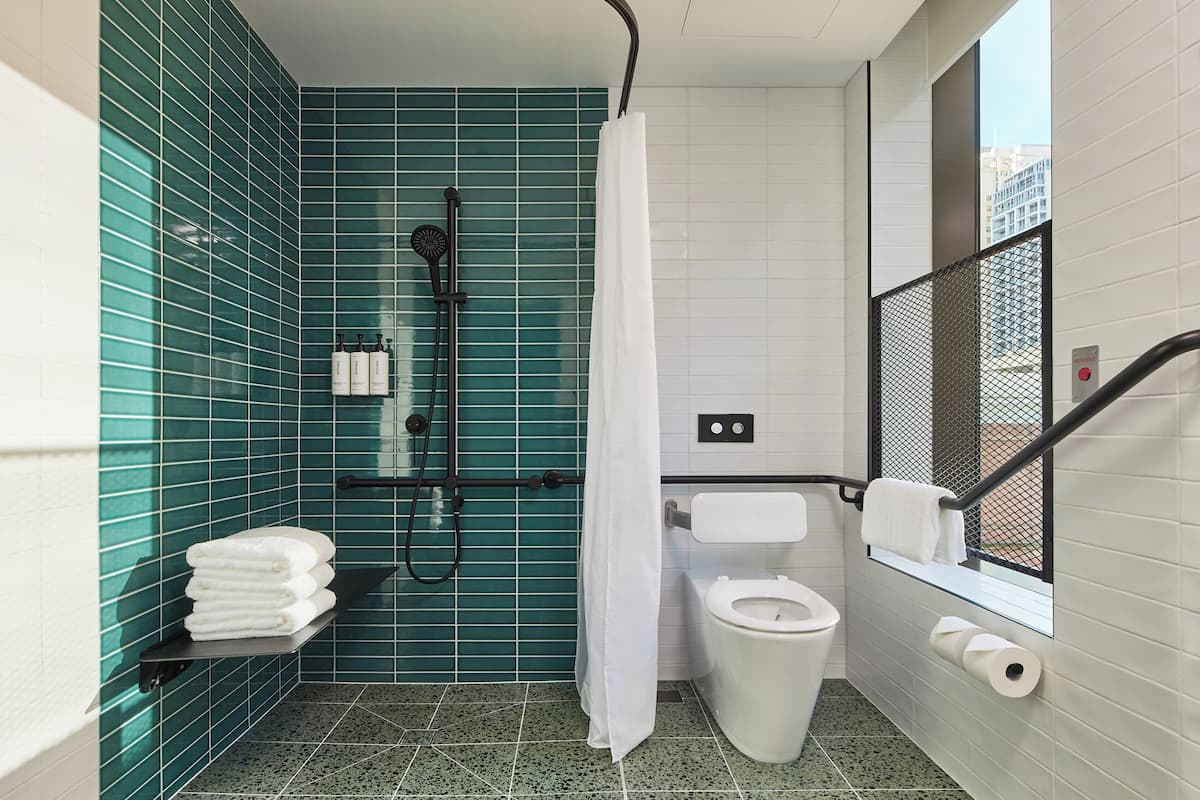 Premium bedding, desk, laptop workspace, iron/ironing board