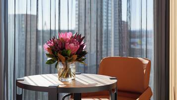 Premium bedding, desk, laptop workspace, iron/ironing board