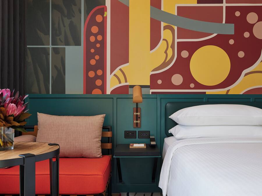 Premium bedding, desk, laptop workspace, soundproofing