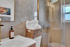Shower, hair dryer, towels, soap
