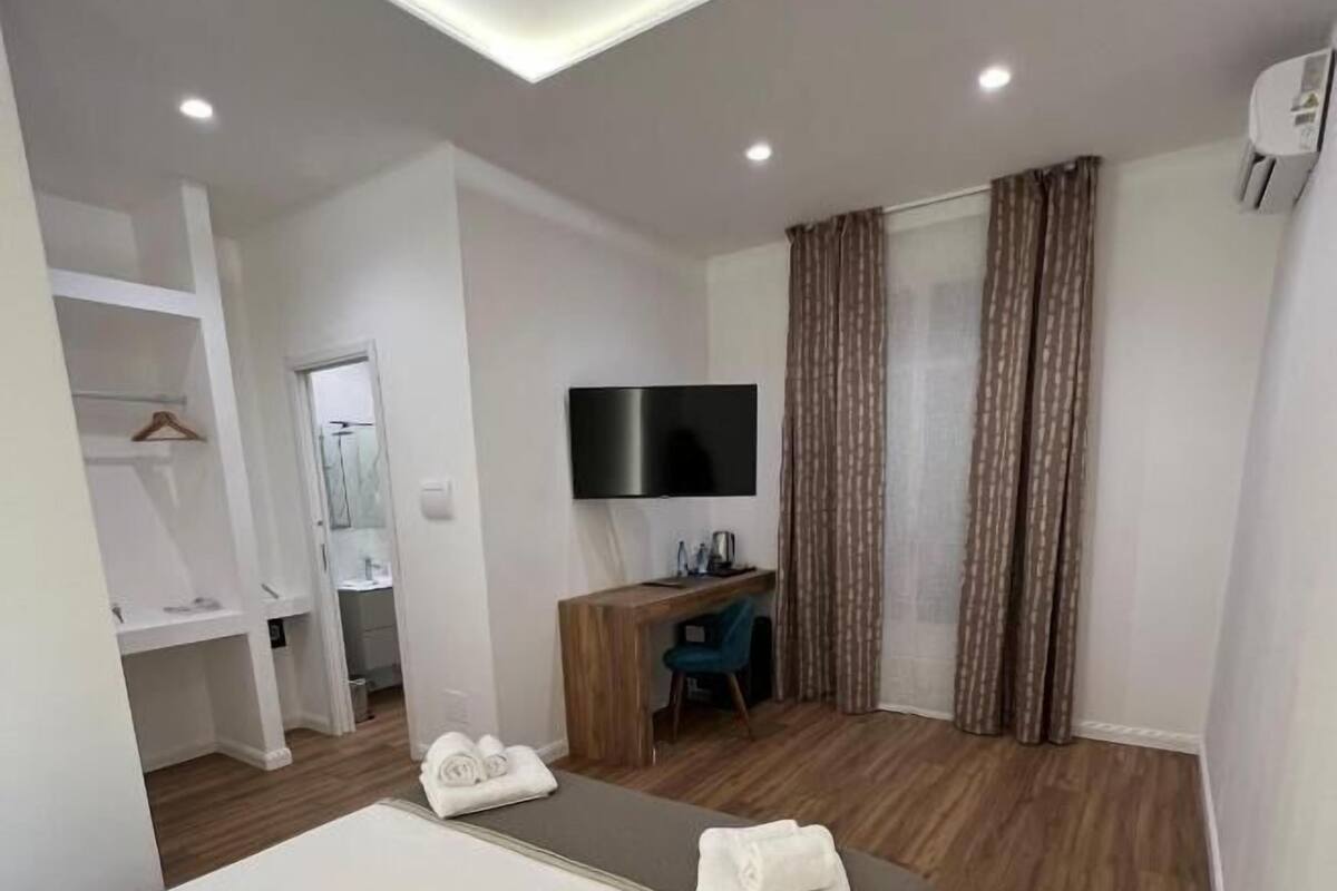Deluxe Double Room, Courtyard View | In-room safe, iron/ironing board, free WiFi