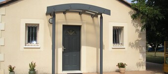 Single-storey residential house overlooking shady park.