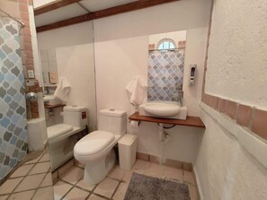 Shower, hair dryer, towels, shampoo