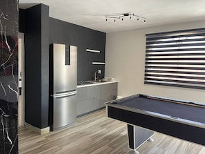 Fridge, microwave, stovetop, coffee/tea maker