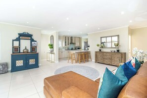 House, Multiple Beds, Pool Access, Pool View (Kawana Crescent ) | Living area | 42-inch flat-screen TV with digital channels, fireplace