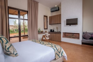 Suite, Garden View | In-room safe, desk, laptop workspace, blackout drapes