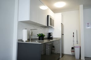 Fridge, microwave, stovetop, coffee/tea maker