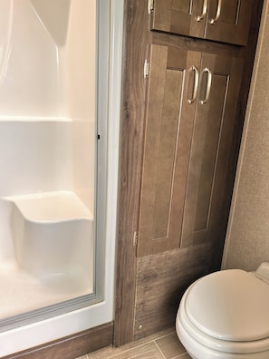 Shower, towels, soap, toilet paper