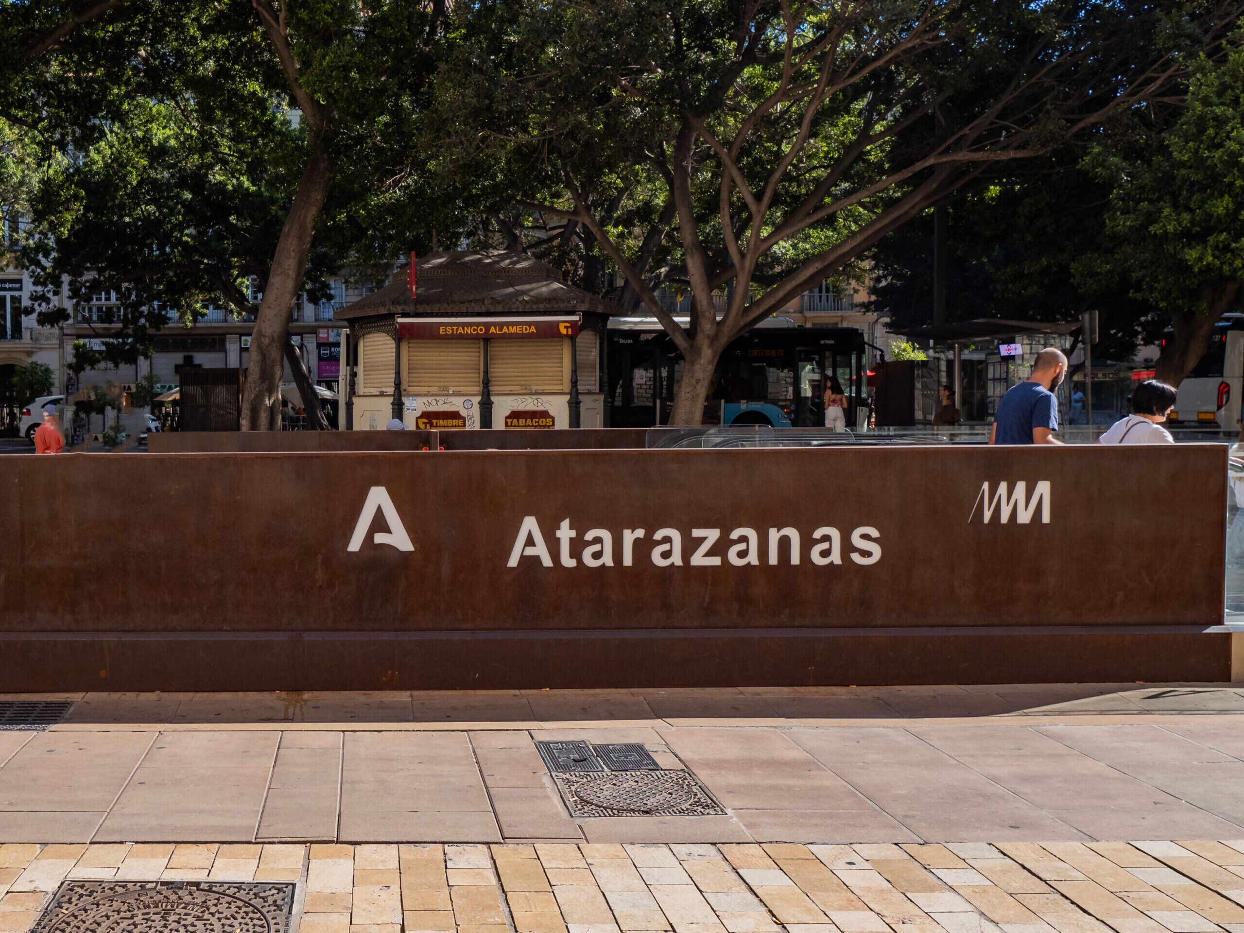A brown sign with the name 'Atarazanas' and a logo.