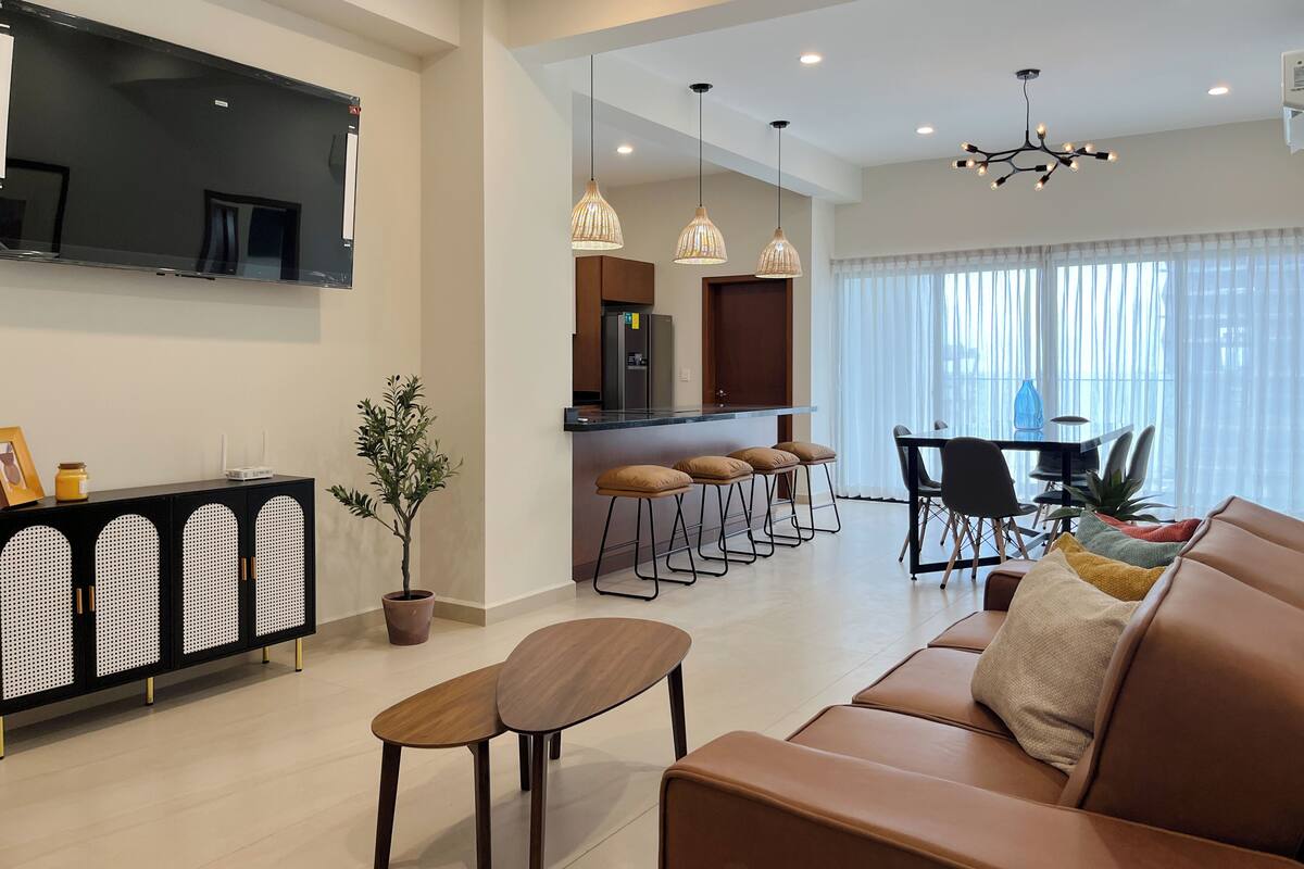 Comfort Apartment, Balcony, Partial Ocean View | Living area | 50-inch flat-screen TV with cable channels