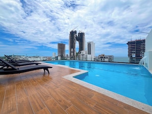 Outdoor pool, open 8:00 AM to 10:00 PM, pool loungers