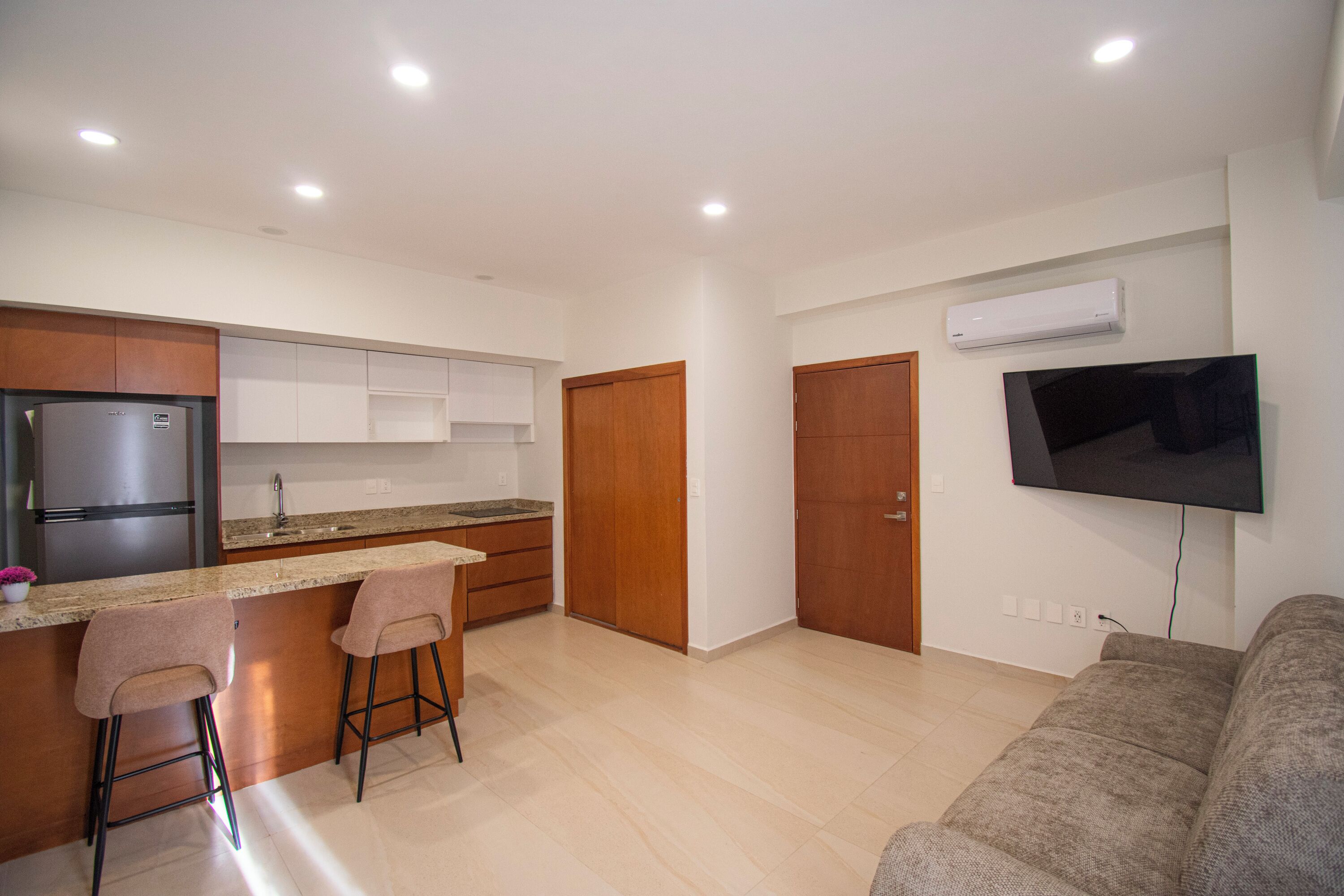 Comfort Apartment | Living area | 50-inch flat-screen TV with cable channels