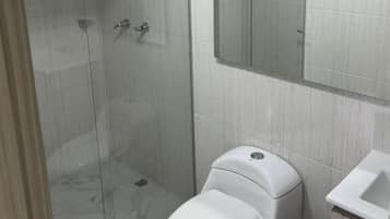 Shower, free toiletries, towels, toilet paper