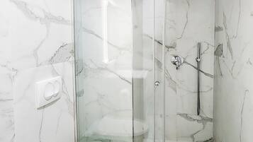 Shower, free toiletries, hair dryer, slippers