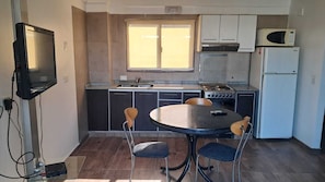 Full-sized fridge, microwave, cookware/dishes/utensils