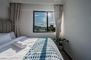 2 habitaciones, tabla de planchar con plancha y acceso a internet 