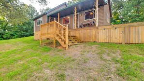 A wooden cabin with a wooden deck and stairs leading to the entrance. - Private Lake & Dock: Log Cabin, 2 Mi to Clay! (Clay)