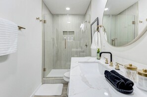 Shower, hair dryer, towels, soap